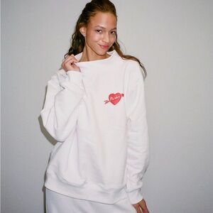 Cozy White Sweatshirt with Red Heart Accent